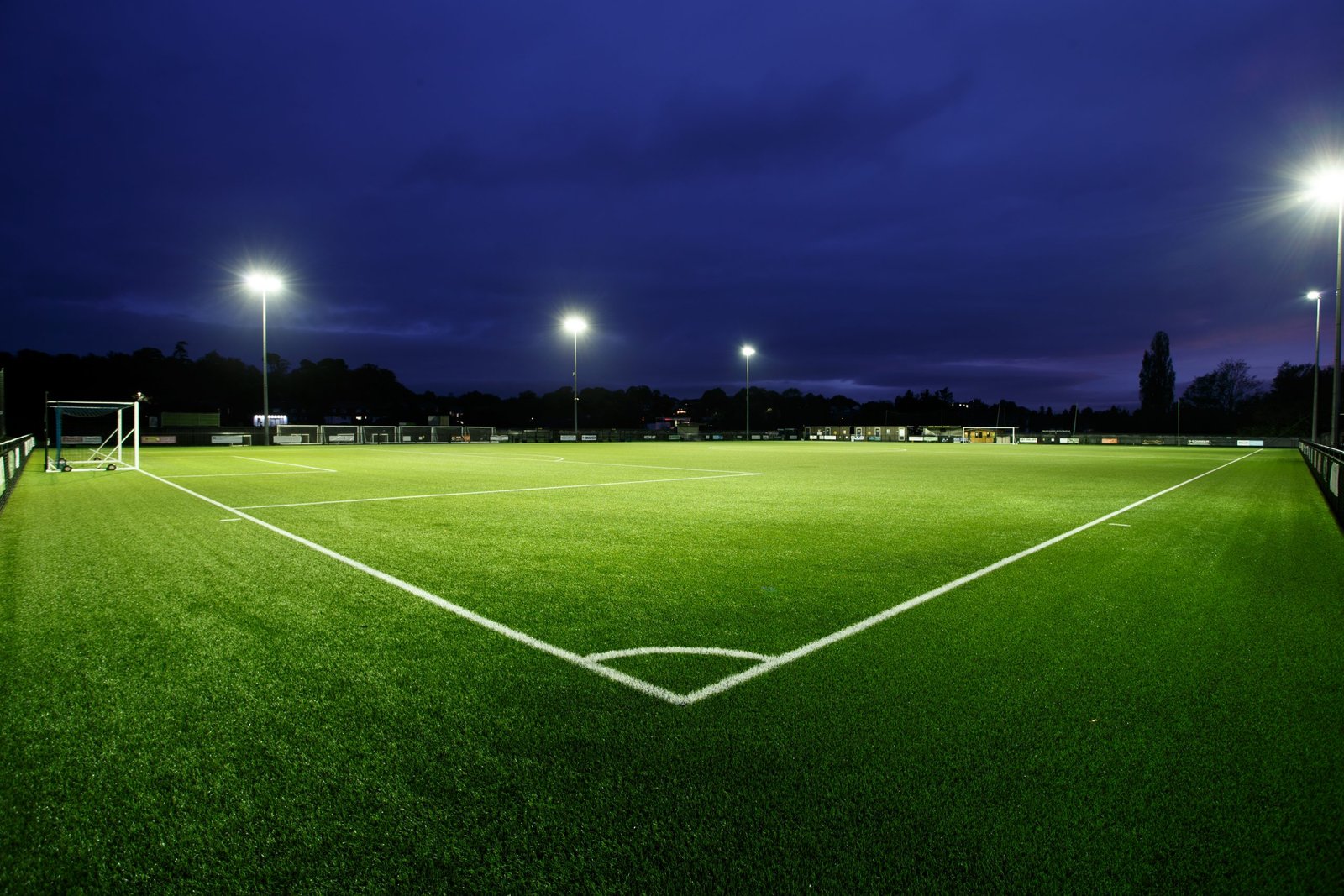 Sports field with stadium lights at night