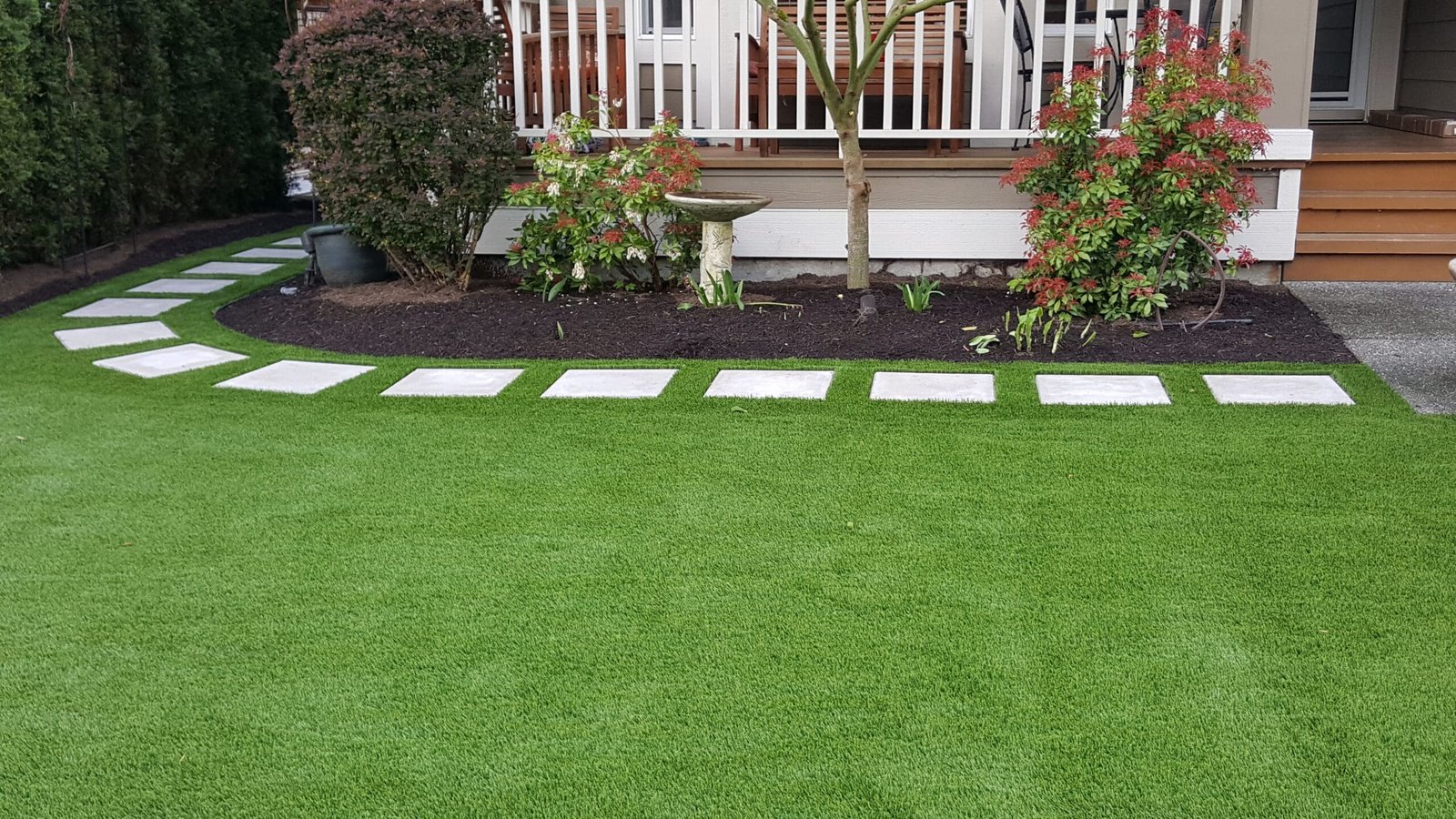 Front yard with stepping stones and turf