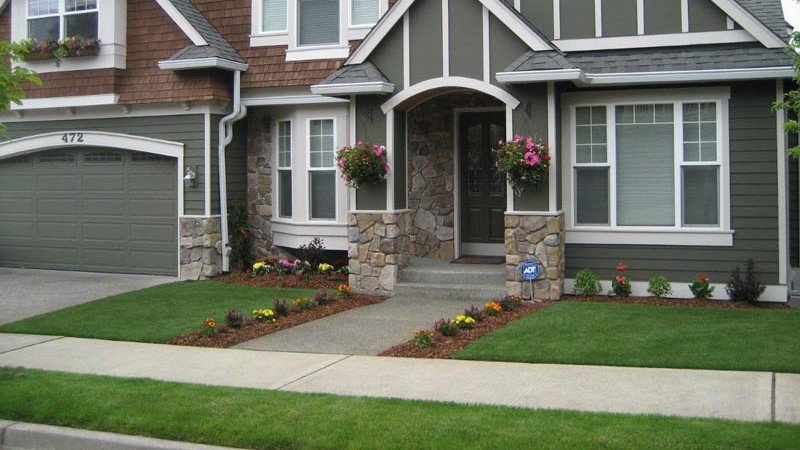 Tudor home with turf front lawn