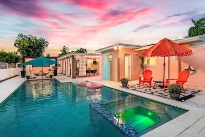 Poolside landscape lighting at coastal sunset