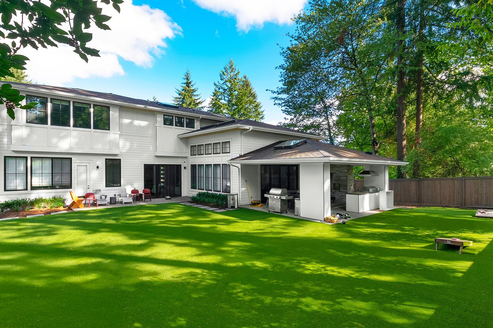 Residential backyard gathering area on turf